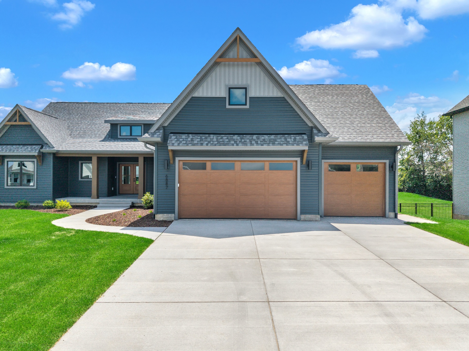 Custom Kerkhoff home exterior with three-car garage