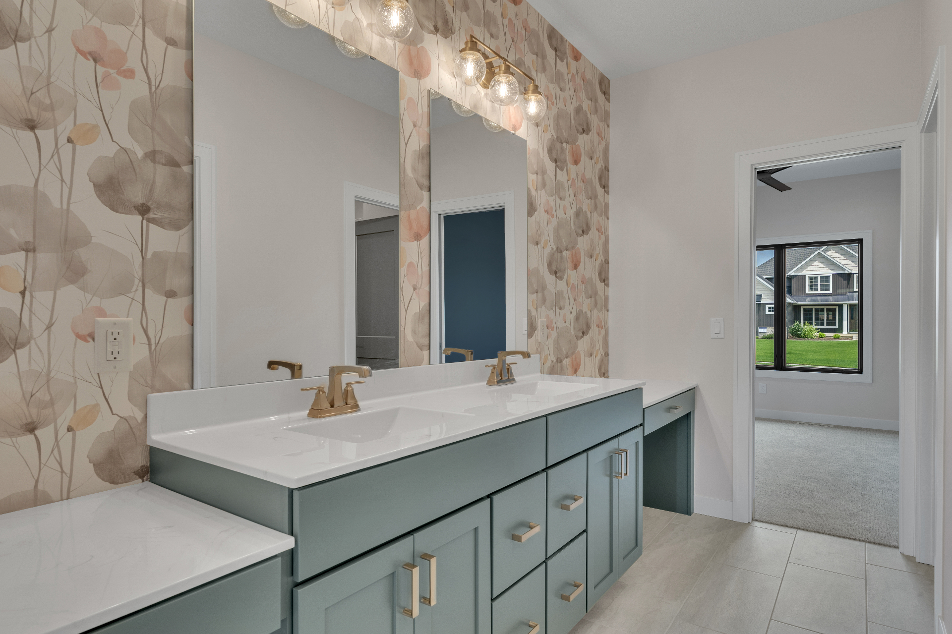 Jack and Jill bathroom with floral wallpaper and dual vanities