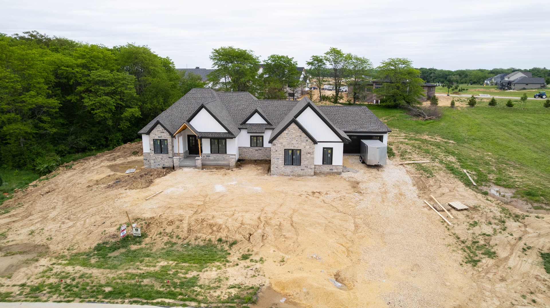 Aerial view of stone-accented Kerkhoff custom home