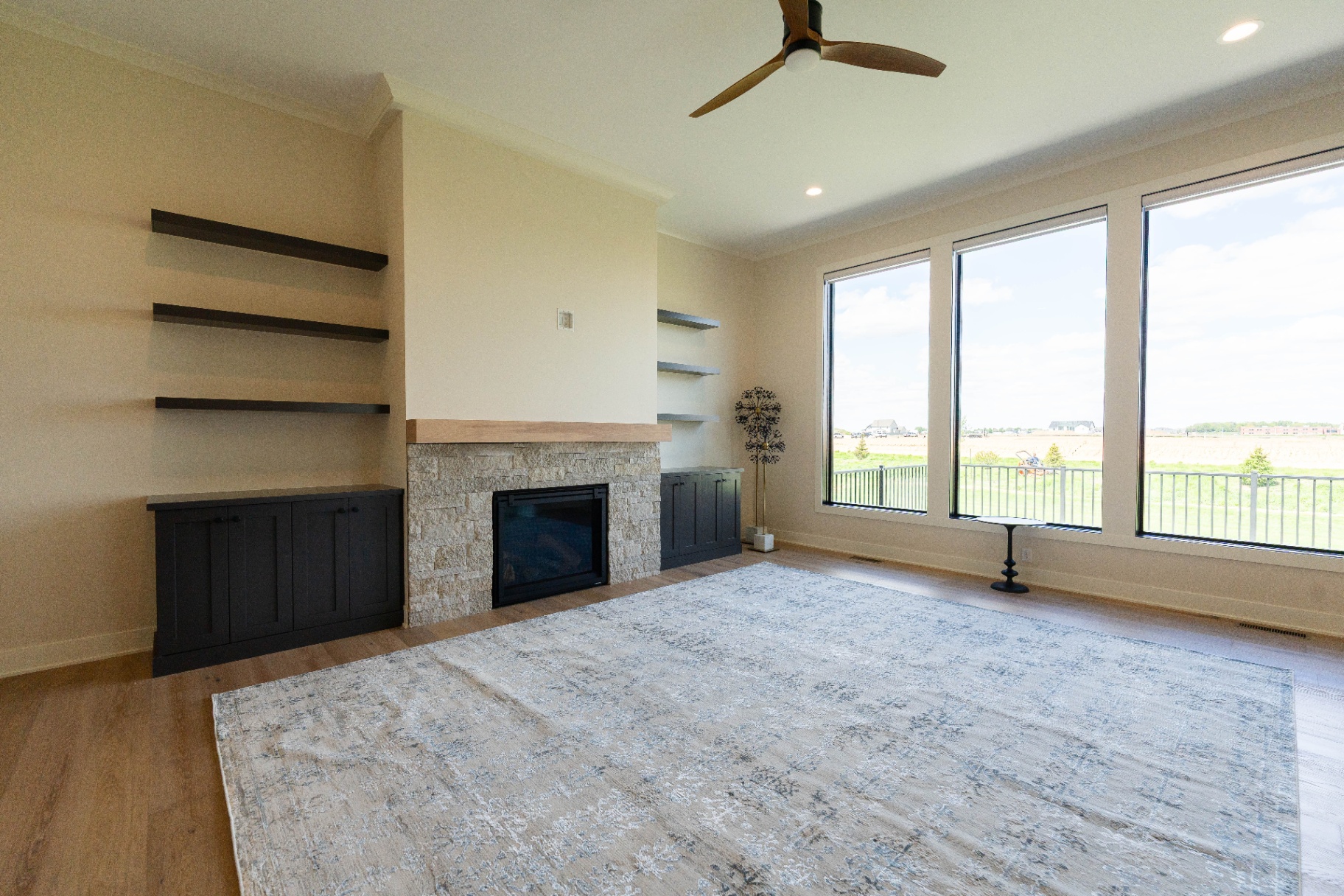 Great room with stone fireplace and built-ins
